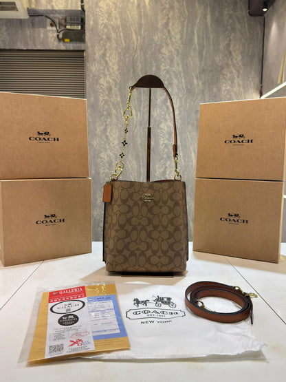 CH mollie signature bucket bag with extra long sling and carry bag